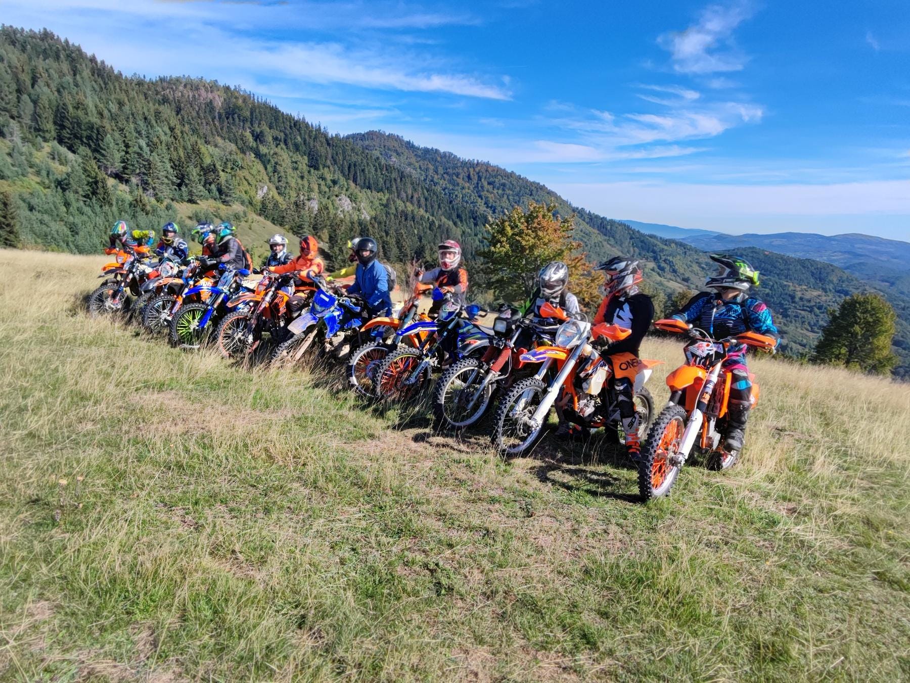 Enduro motorcycle adventure in the stunning Bosnian mountains with dramatic landscape and misty peaks